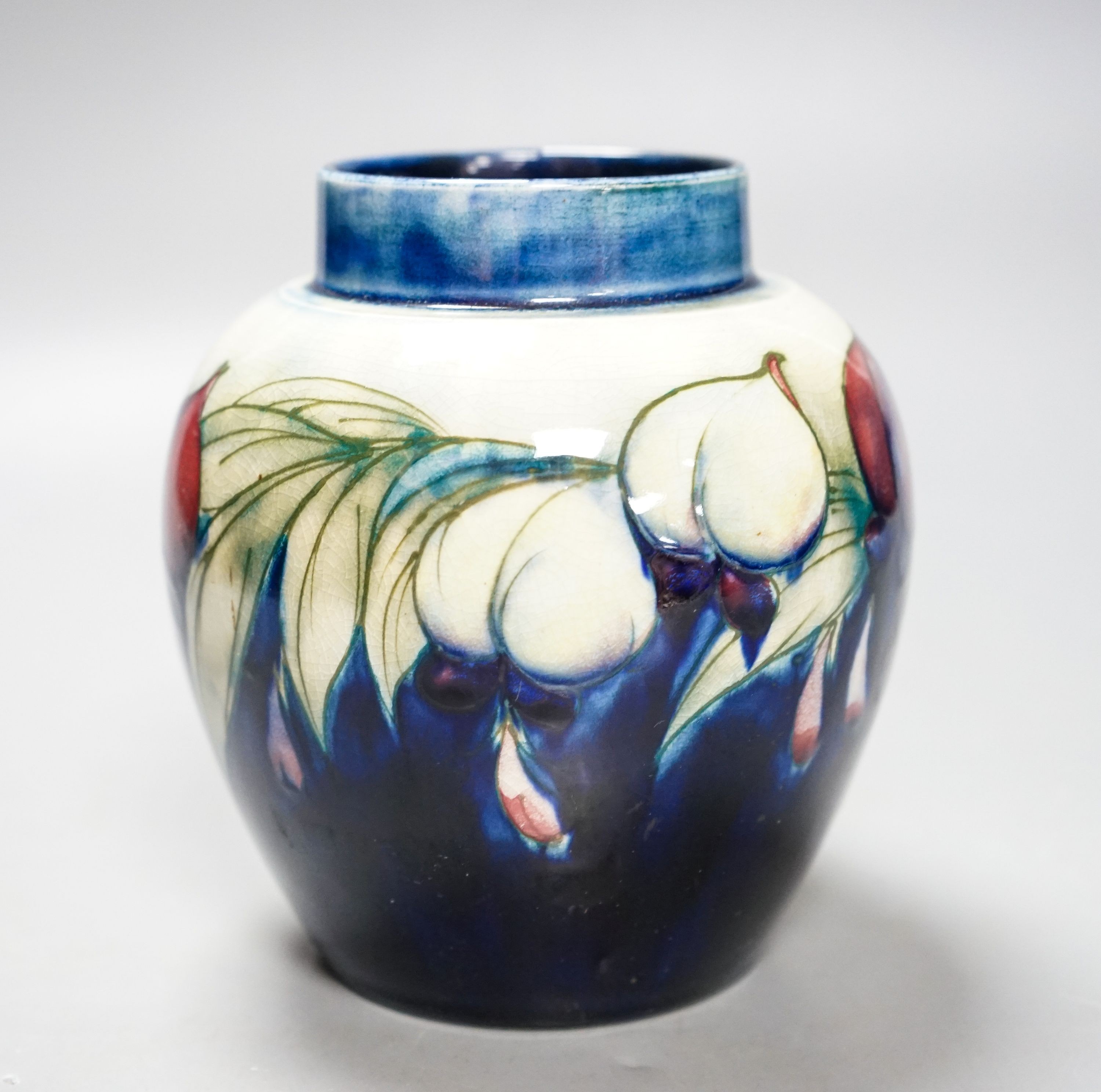 A Moorcroft wisteria pattern jar 13cm